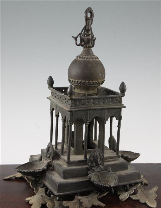 An Indian bronze hanging architectural oil lamp, 10in.